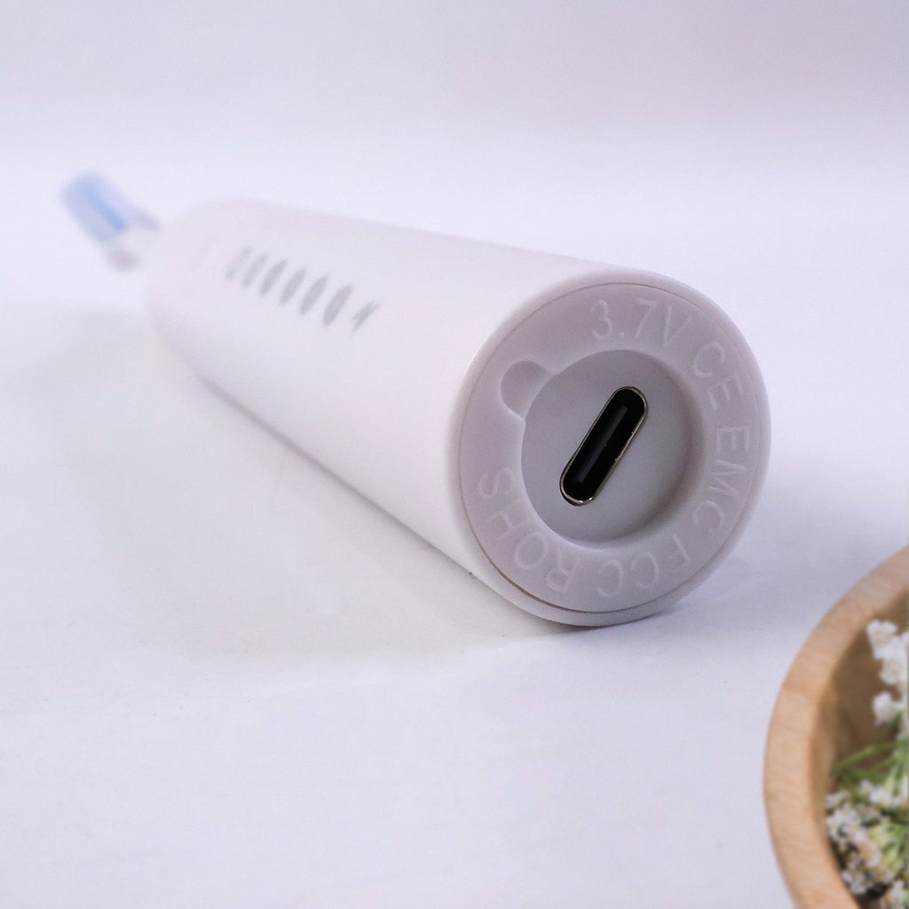 Close detail of ergonomic handle on rechargeable electric toothbrush
