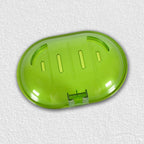 Plastic soap dish holder securely attached to a ceramic tile wall.