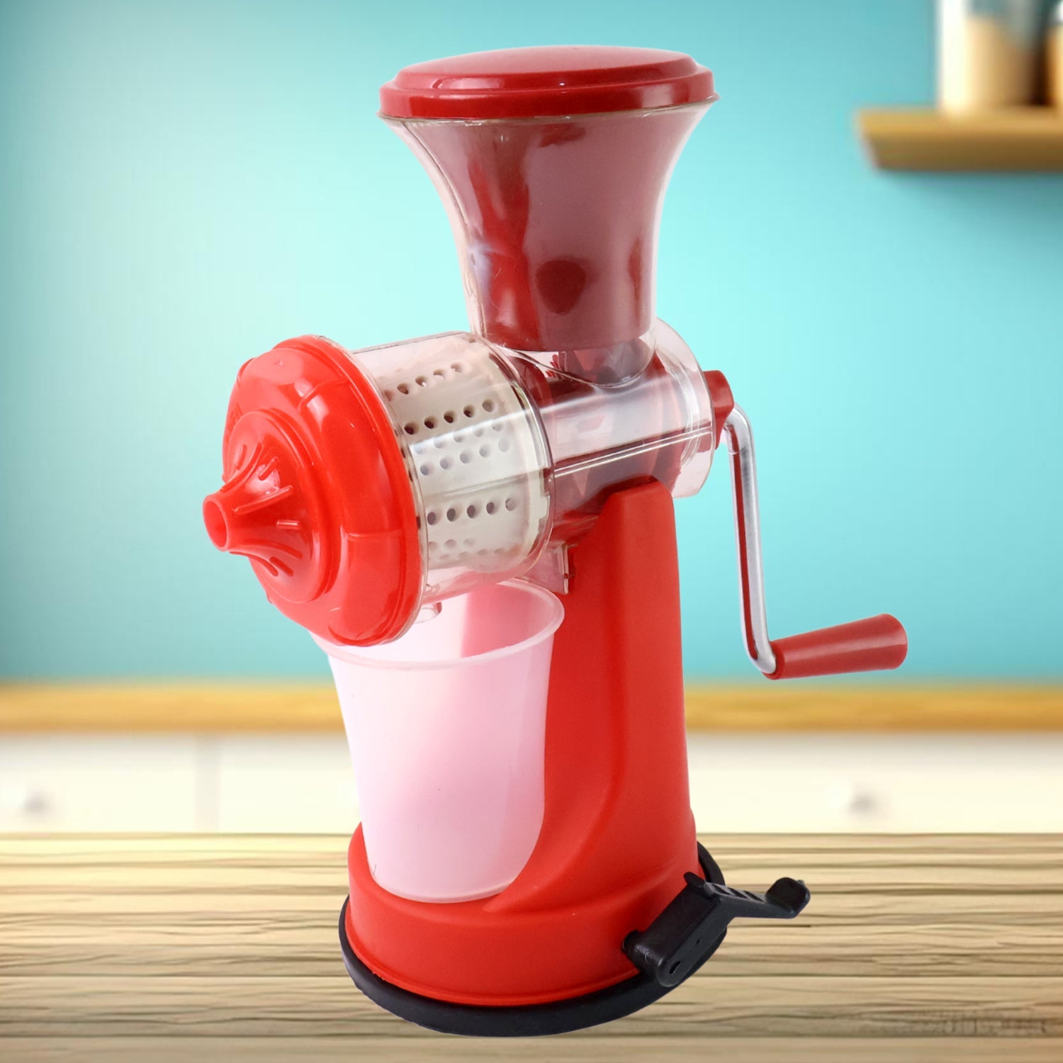 Grippy manual juicer actively pressing an orange to extract fresh juice.