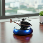 Compact car freshener with helicopter design rotating in sunlight