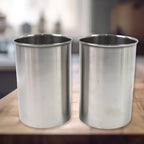 Three Konvex multipurpose steel containers displayed in a bright, organized kitchen setting.
