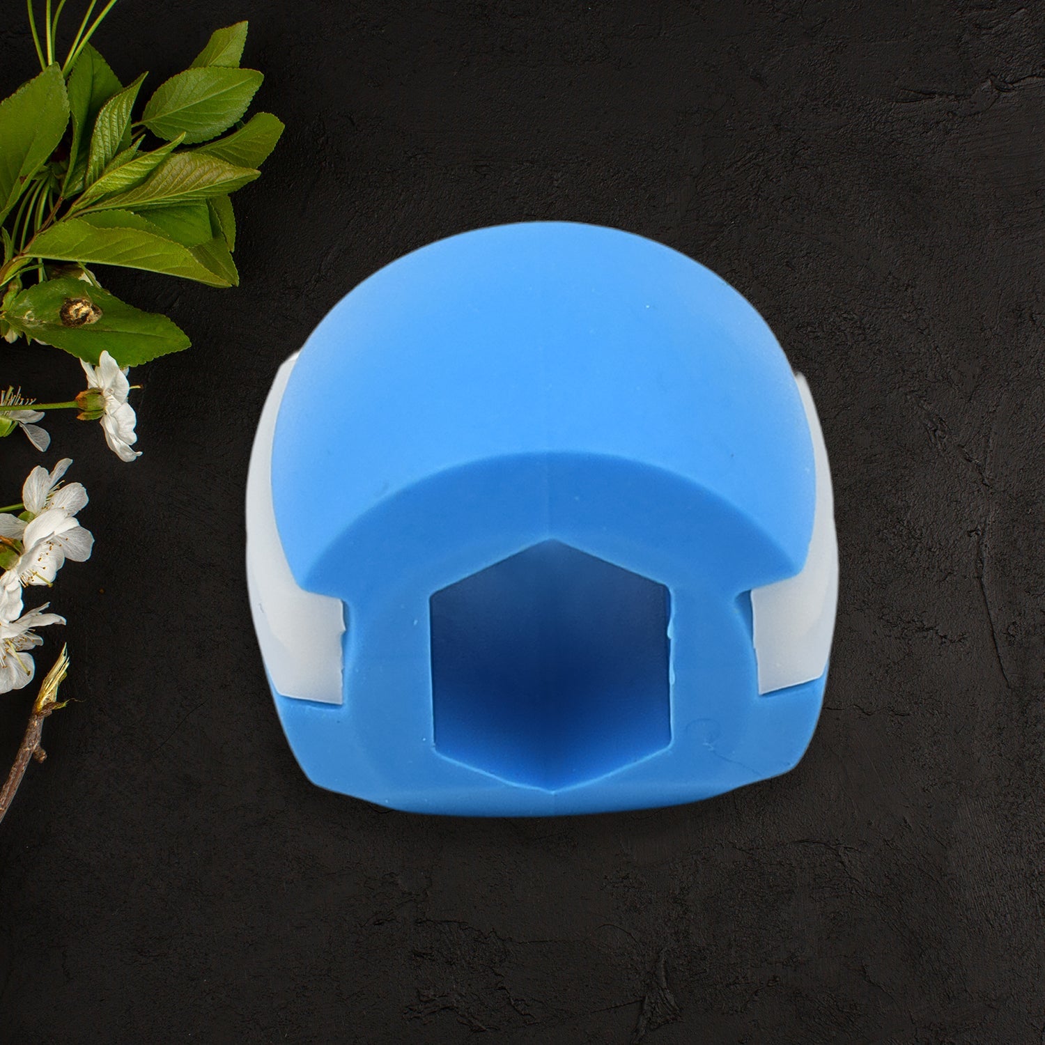 An array of blue Jawline Exercisers displayed from multiple angles.