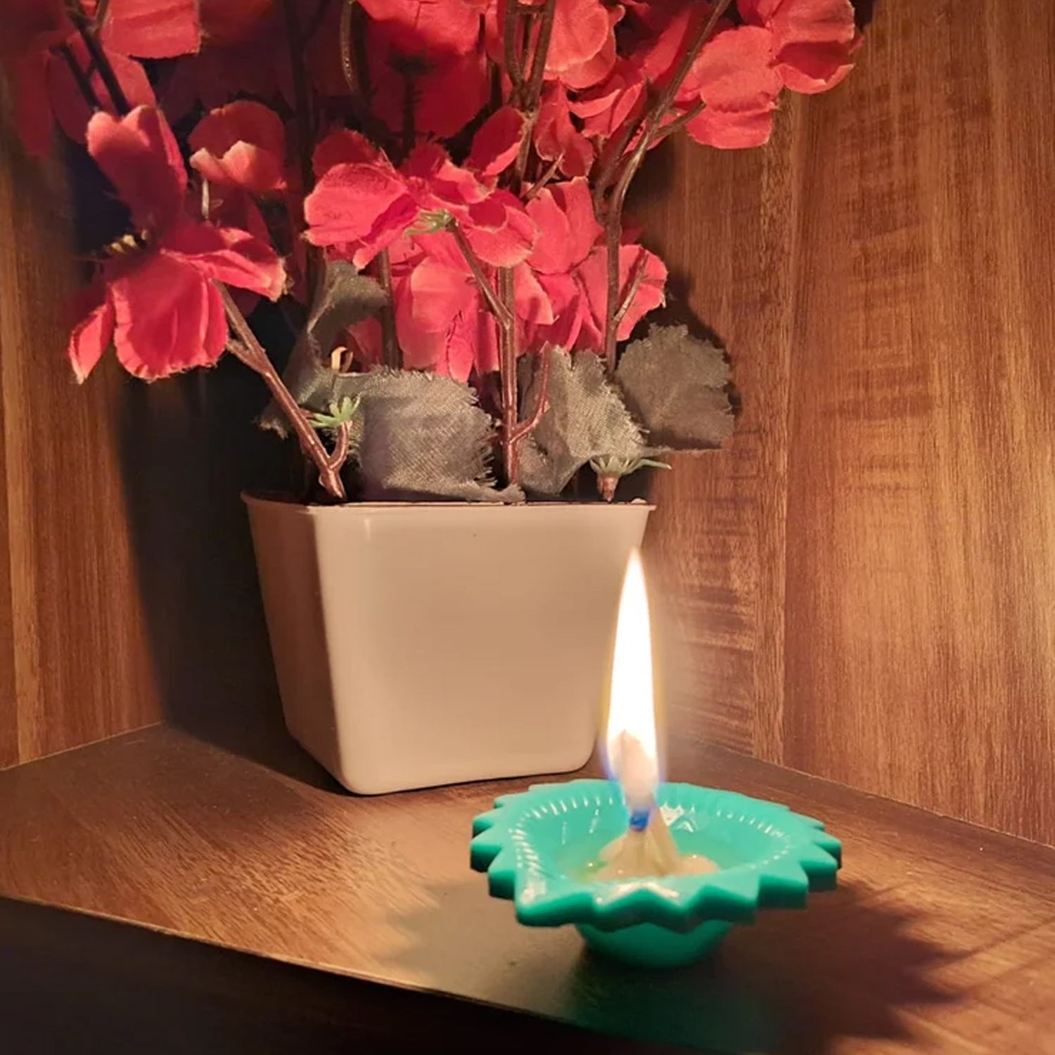 Multiple colourful silicone diyas glowing warmly in a beautiful festive arrangement.