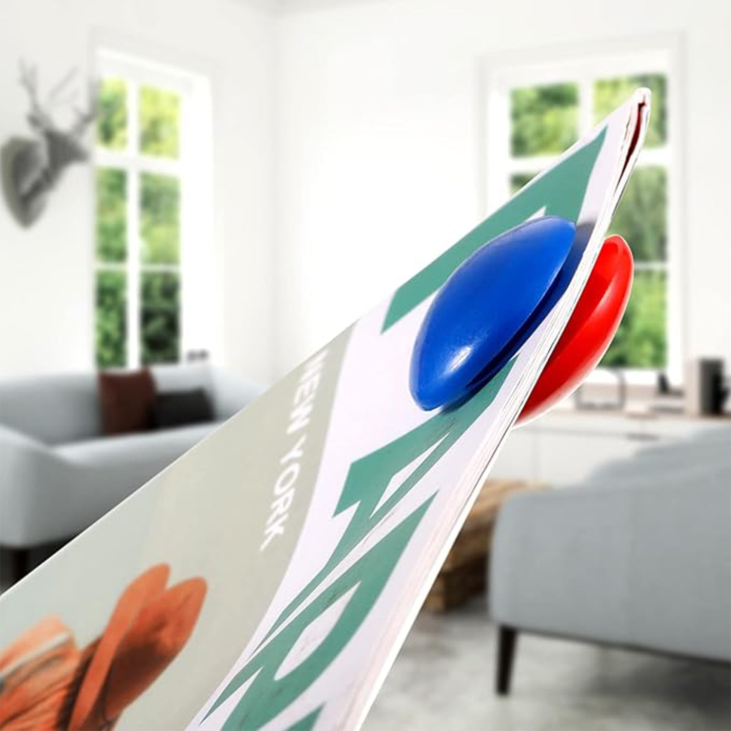 Red magnetic stick buttons attached firmly on whiteboard surface