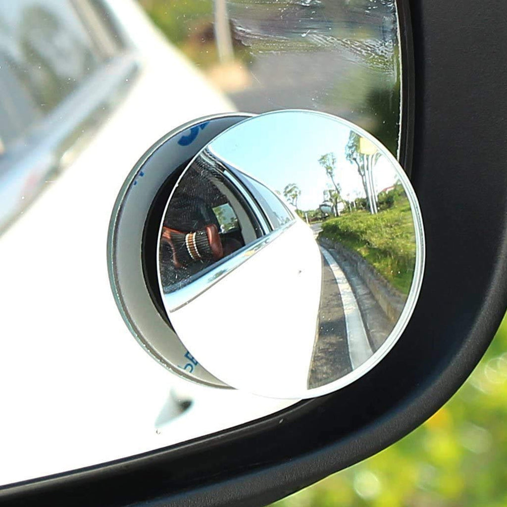 Pair of round wide-angle blind spot mirrors attached to a car's side mirror.