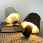 USB rechargeable LED bottle lamp glowing softly on a wooden table, showcasing dimmable light.