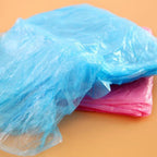 Travel-friendly disposable raincoat in compact packaging, easy to carry.