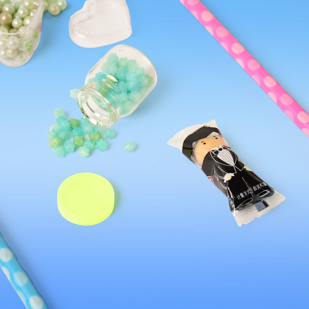Pencil accessories including sharpener and storage jars in candy design
