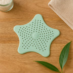 Top view of star style silicone drain cover showing suction cups underneath