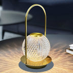 Crystal ball rechargeable LED touch lamp illuminating a modern bedroom.