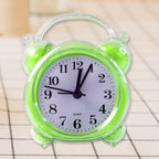 Close-up of quartz alarm clock white dial with bold black numerals