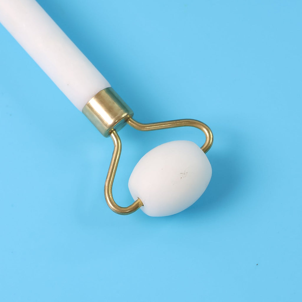 Radiant skin after using the dual-ended face massage roller in a skincare routine.