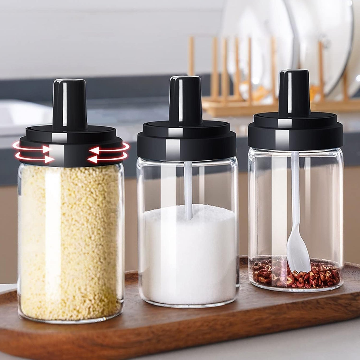 Detailed close-up of the Glass Spice Jar with its attached spoon and leakproof lid.