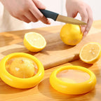Yellow vegetable and fruit saver with a clear lid, showcasing fresh produce.