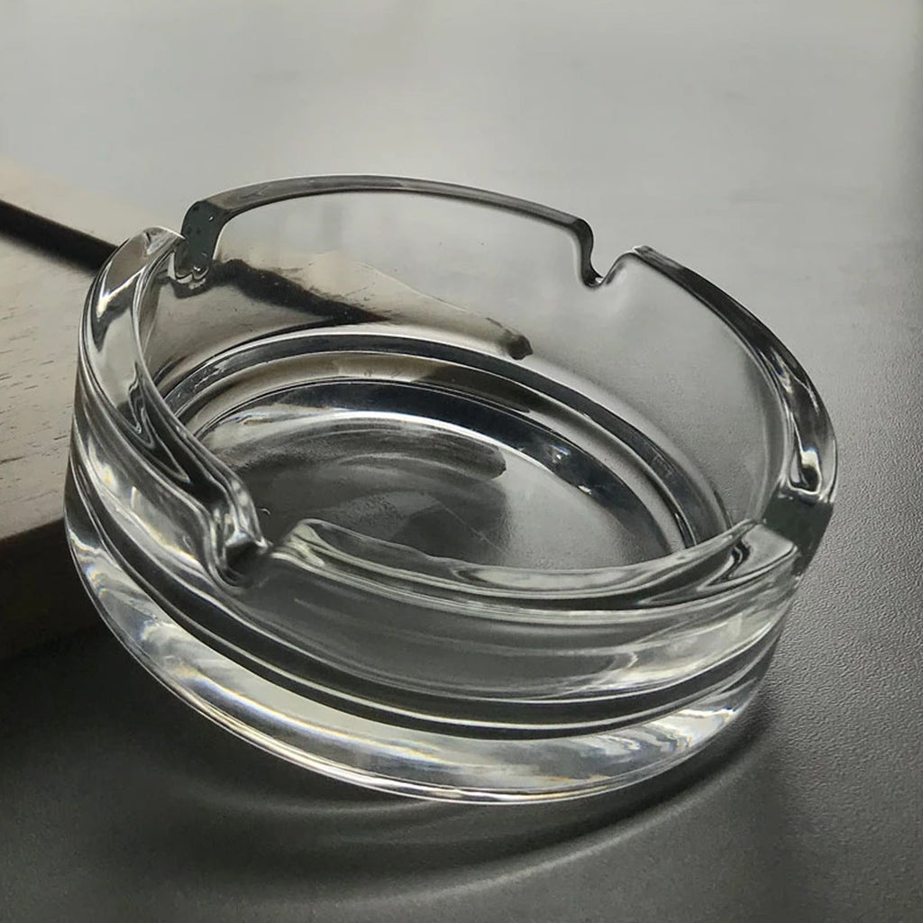 Durable crystal glass ashtray suitable for both indoor and outdoor use.