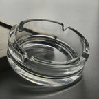 Durable crystal glass ashtray suitable for both indoor and outdoor use.