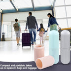 Hand holding a blue Konvex travel toothbrush holder, showcasing its portable design.