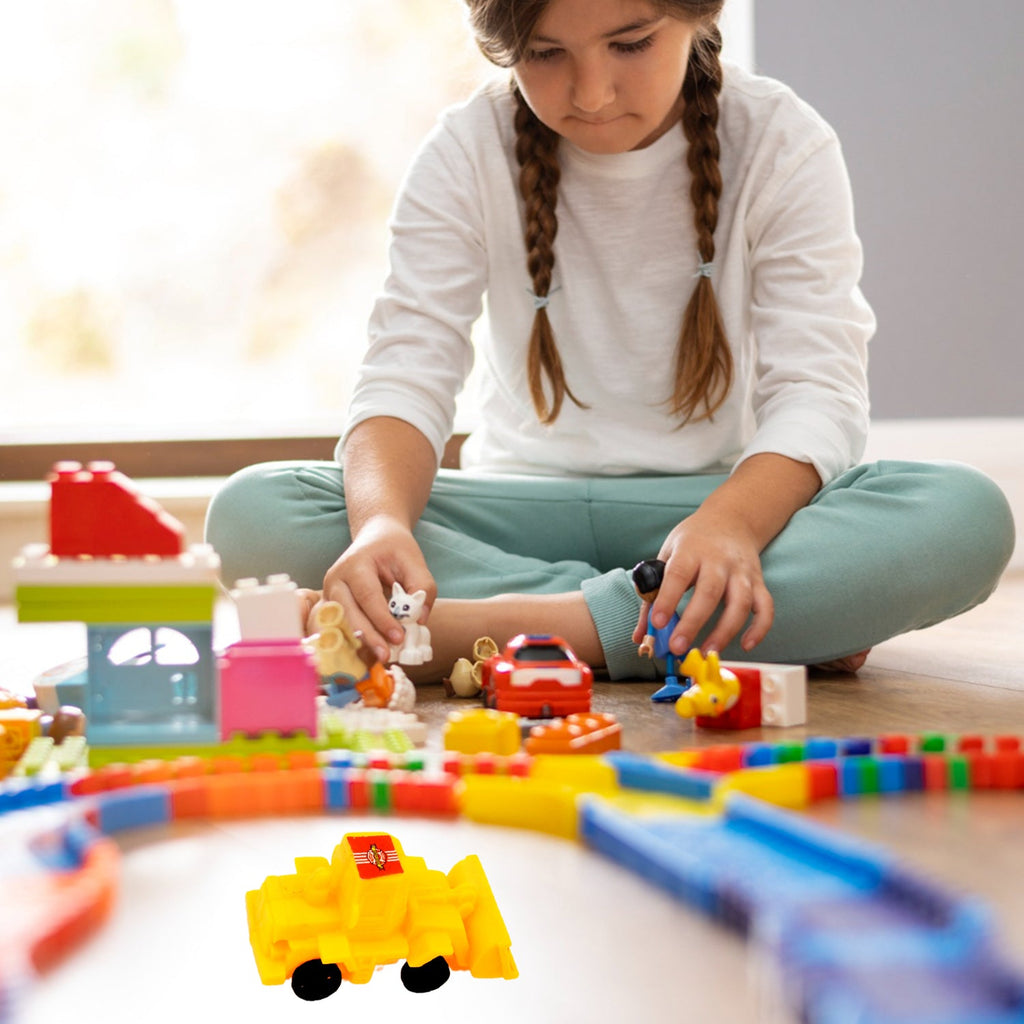 A child playing happily with the pull-back construction vehicle toys on a playmat.
