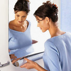 Styleva 3D mirror wall stickers creating a modern look in a living room.