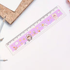 Children using cartoon-themed plastic ruler for drawing and geometry