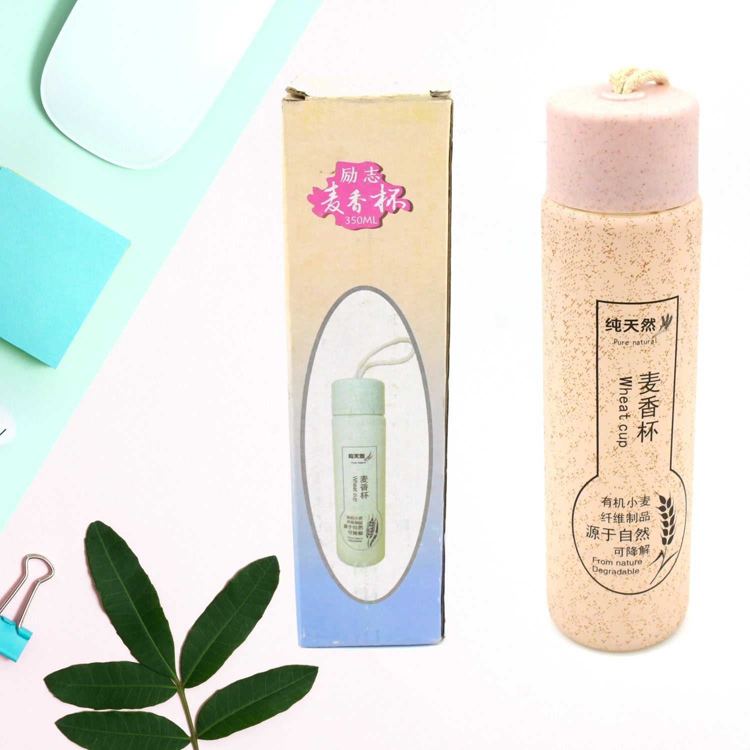 Close-up of the elegant bamboo lid on the 350ml glass water bottle.