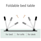 Individual using the portable bed desk for reading a book and taking notes in a relaxed setting.