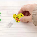 Collection of colorful cartoon erasers, showcasing diverse designs.
