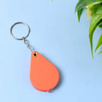 Folded magnifying glass keychain with protective casing closed