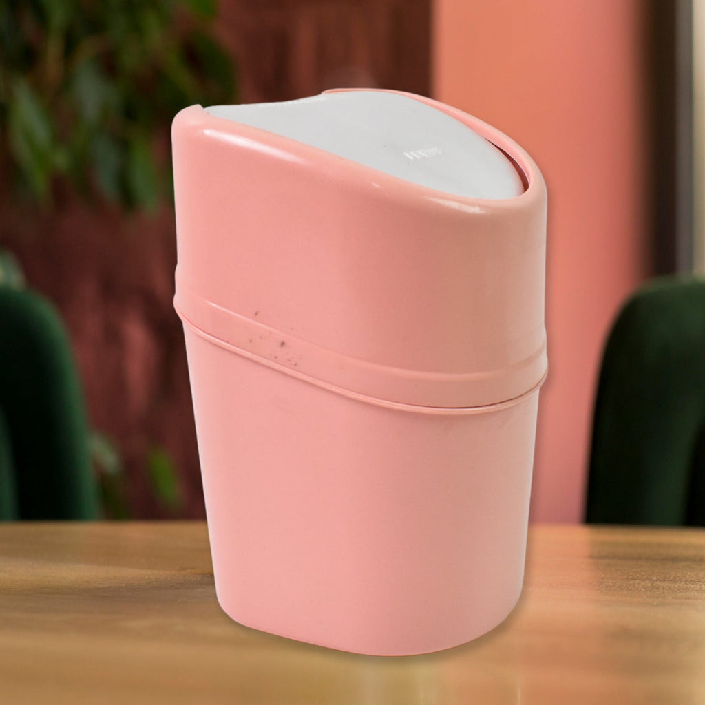 Close-up of the durable plastic swing lid mechanism on the mini dustbin.