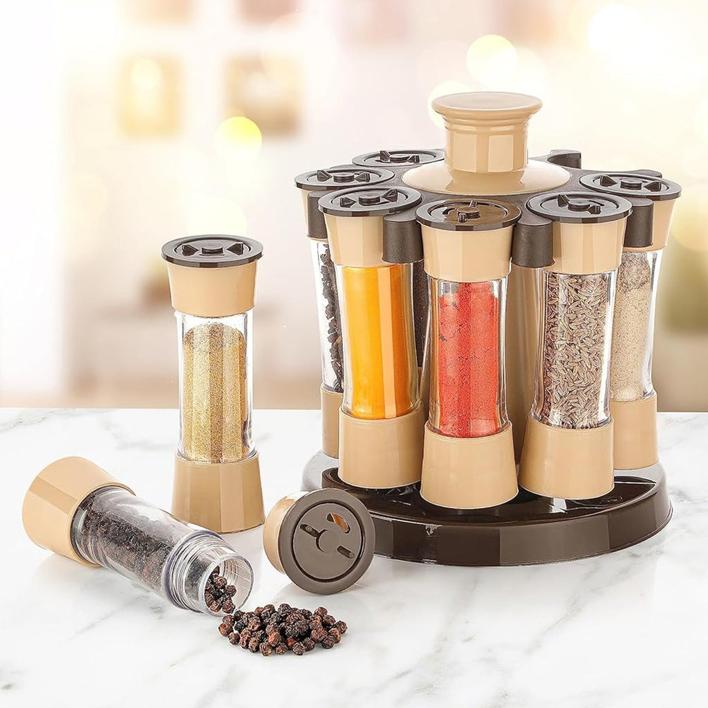 Revolving spice rack with 8 transparent jars displayed on a kitchen counter.