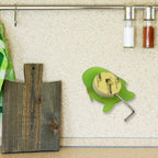 Heavy-duty self-adhesive hook keeping keys organized by the door.