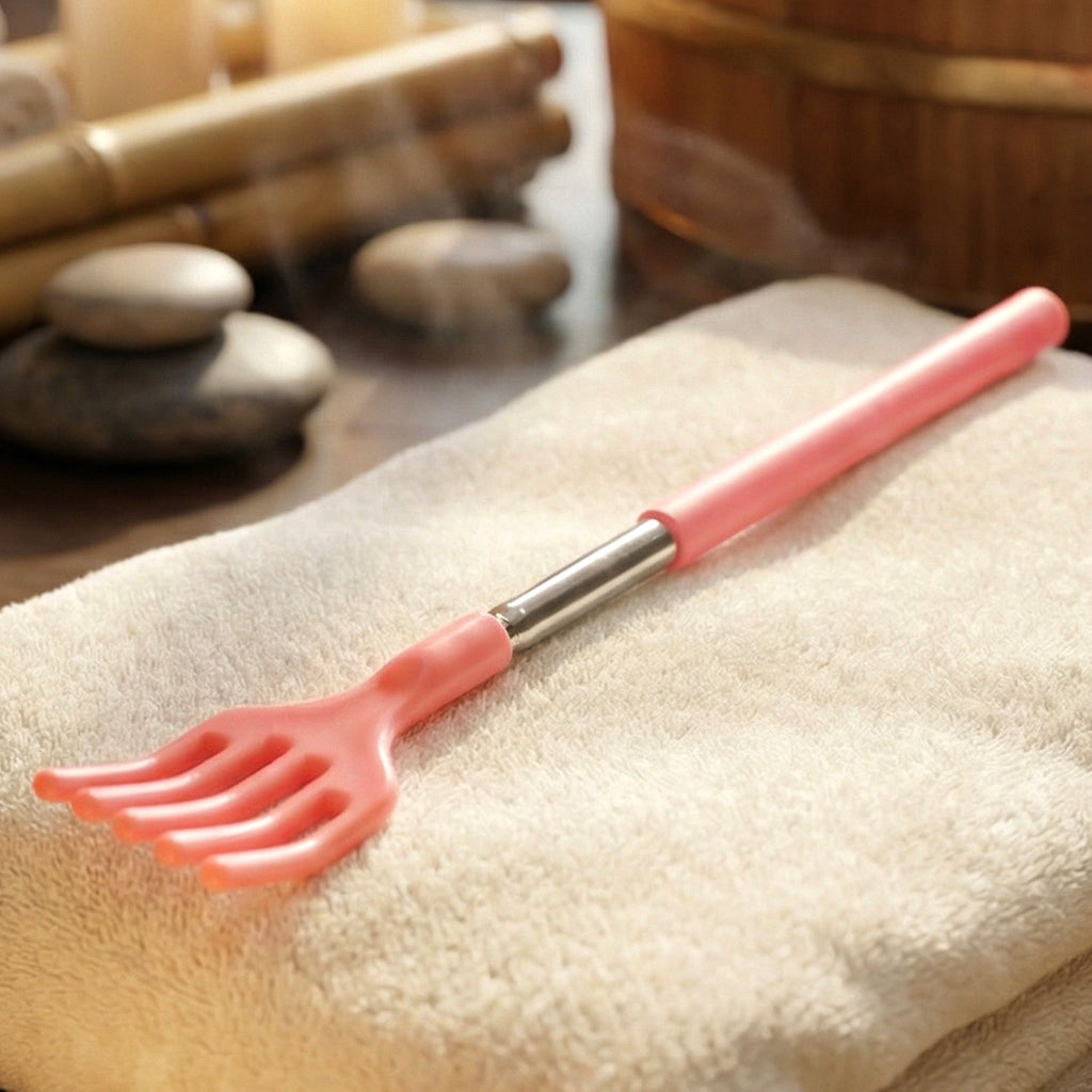 Hand holding the Khujli Stick, demonstrating its comfortable anti-slip grip.