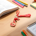 Decorative snake shaped key holder with strap and clip