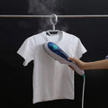 Portable Garment Steamer in use, quickly removing wrinkles from clothing.