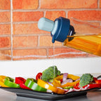 Side profile of the 1L oil dispenser bottle, highlighting the convenient silicone basting brush.