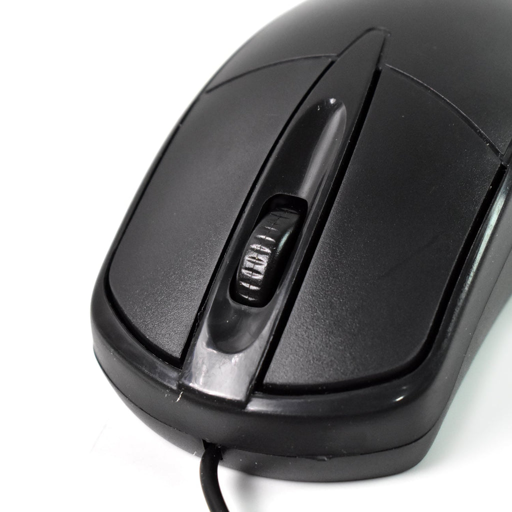 Underside view of the wired optical mouse, revealing the precise optical sensor.