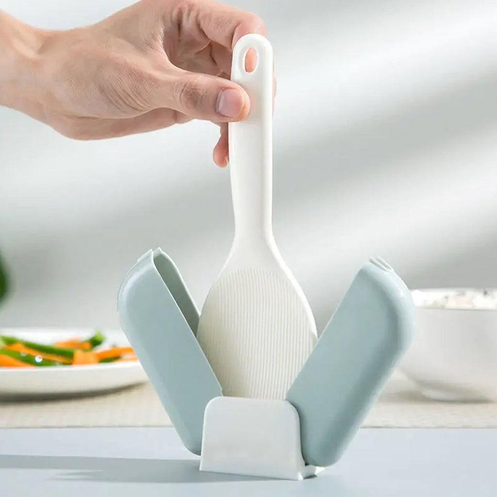 Transparent dust cover protecting rice spoon in automatic holder