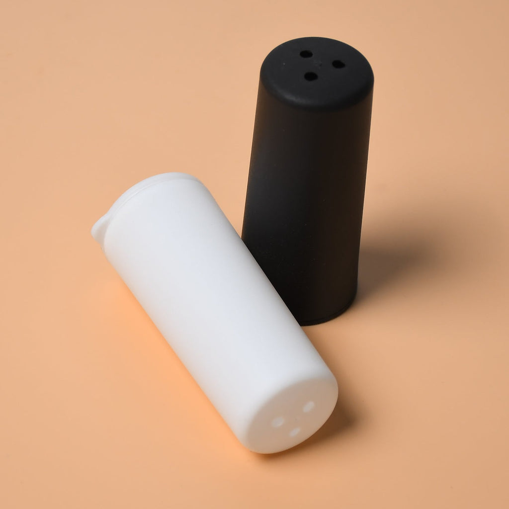 A set of Tidy Table spice dispensers on a clean kitchen counter.