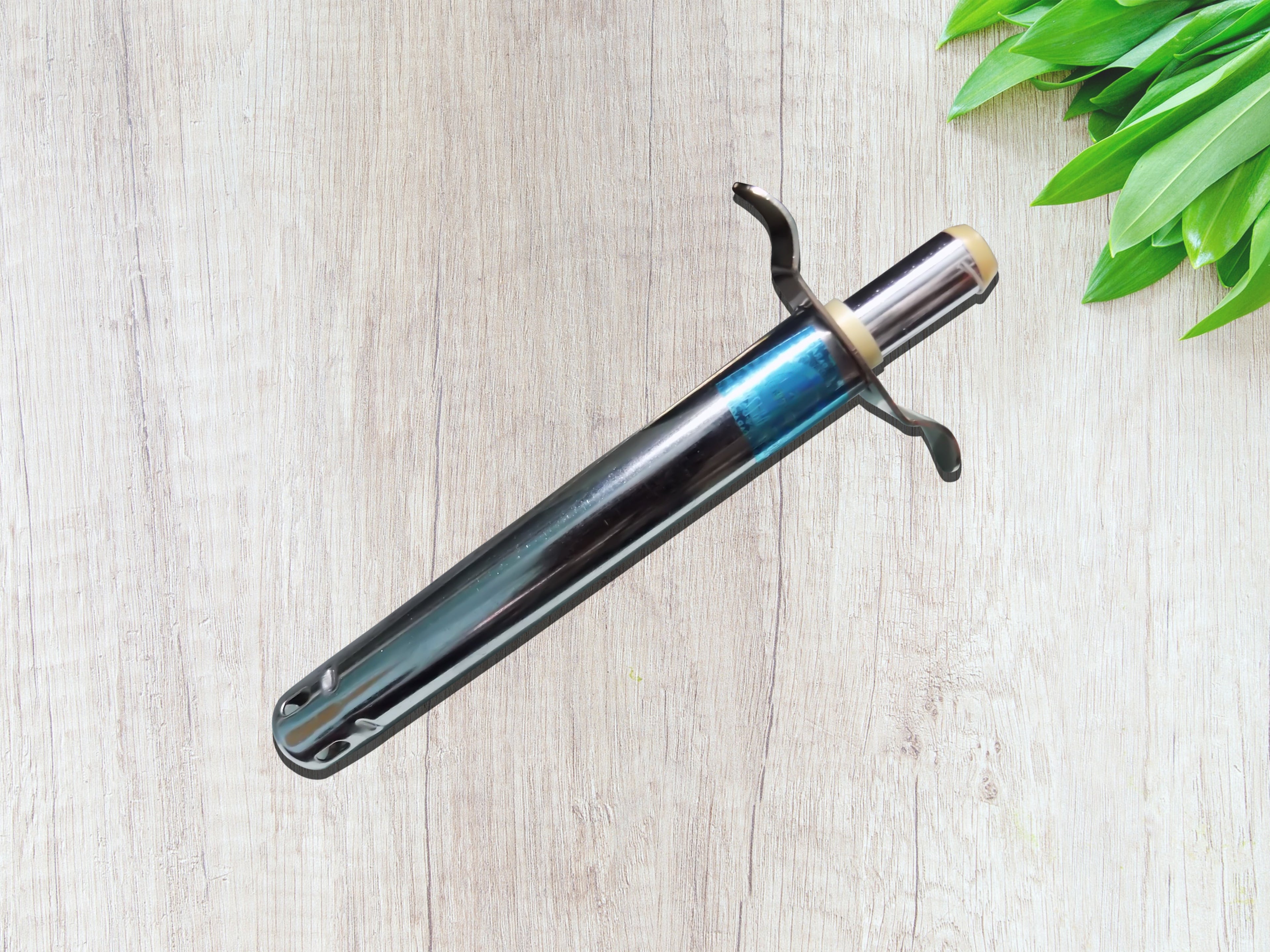 Chef demonstrating the utility knife from the 4-in-1 kitchen tool set