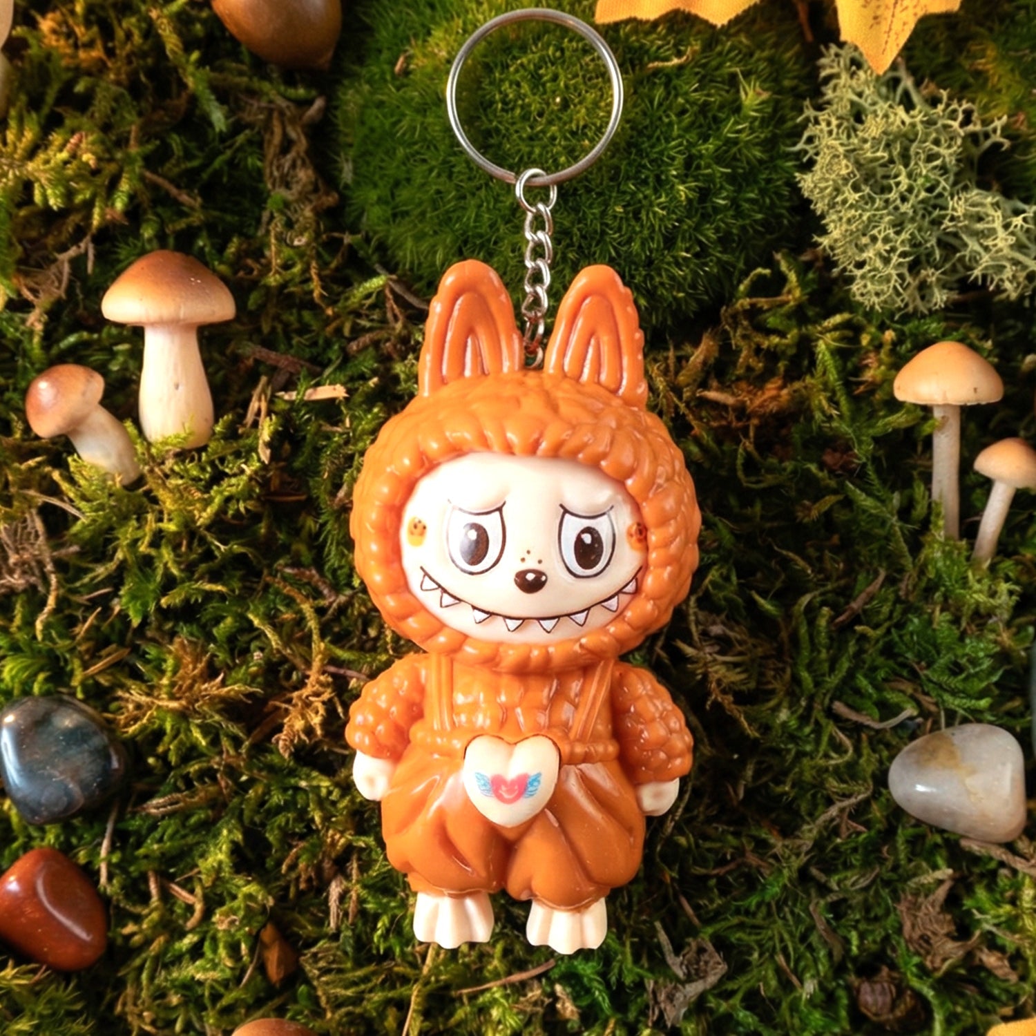 Face changing cartoon toy keychain with attached keyring