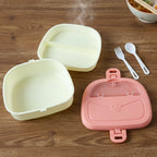 Plastic lunch box set displaying bottle and separated food compartments