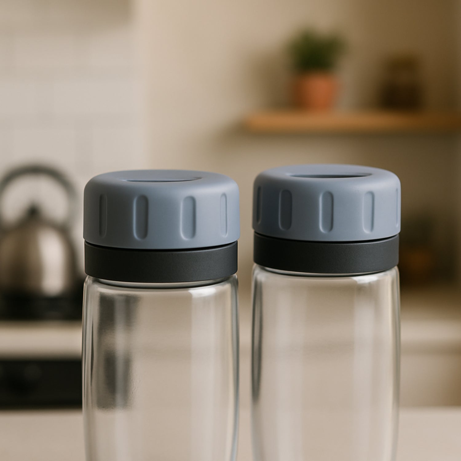 Minimalist setting featuring Apex salt and pepper shakers with clear acrylic bodies