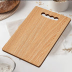 Thick wooden vegetable cutting board resisting knife scaring.