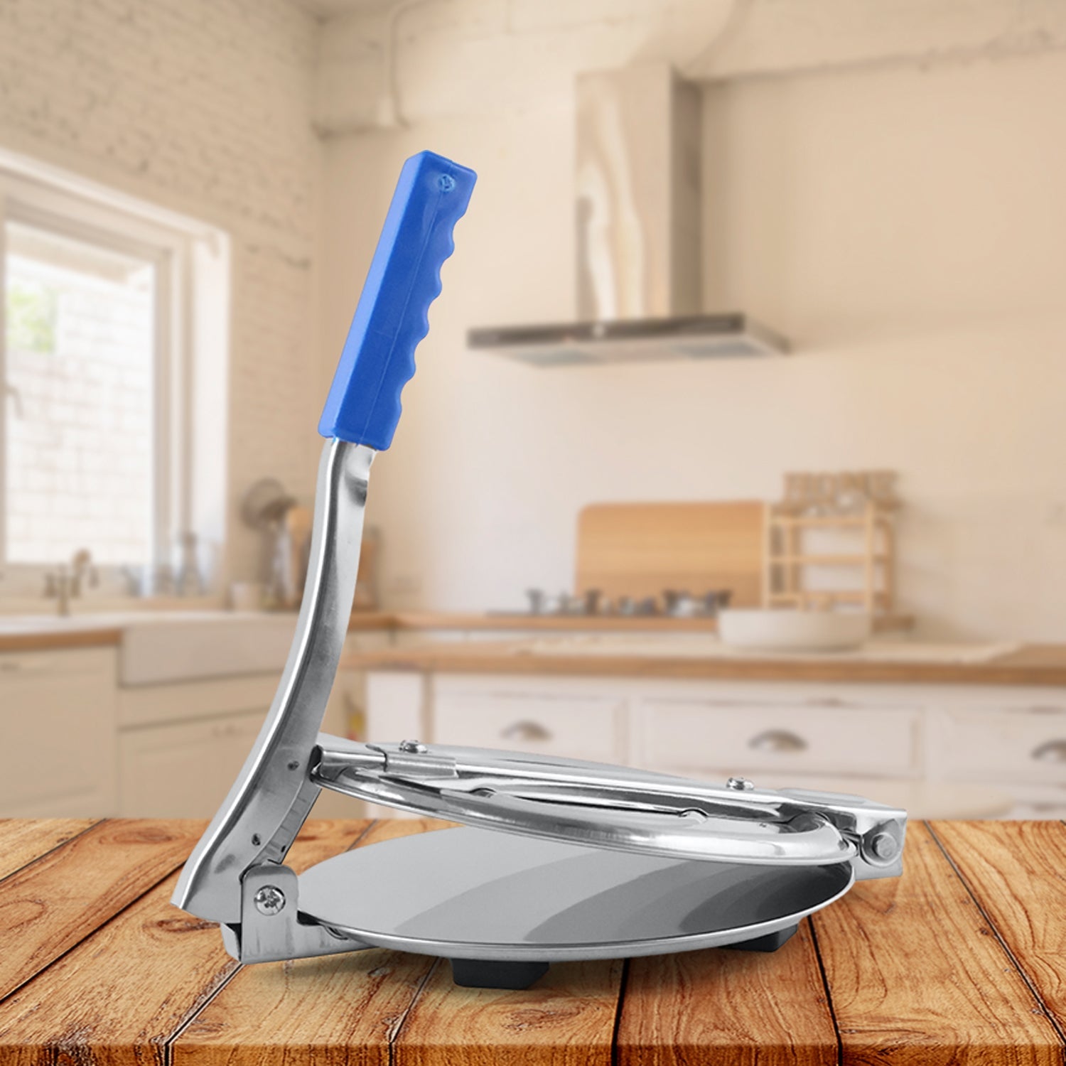 Ergonomic manual puri press with a comfortable, textured handle for easy operation.