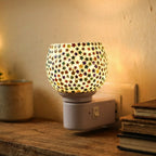 Star pattern night lamp plugged into outlet featuring built-in on/off switch