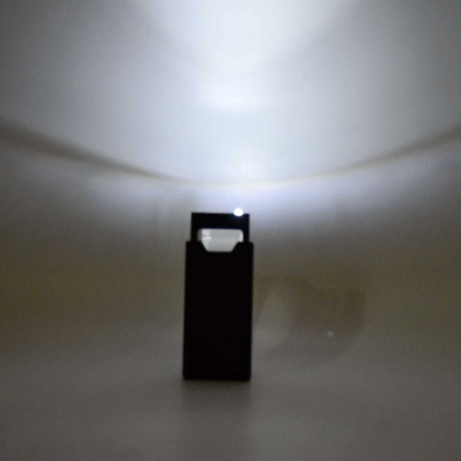 Side view of extendable LED magnifier with durable ABS body