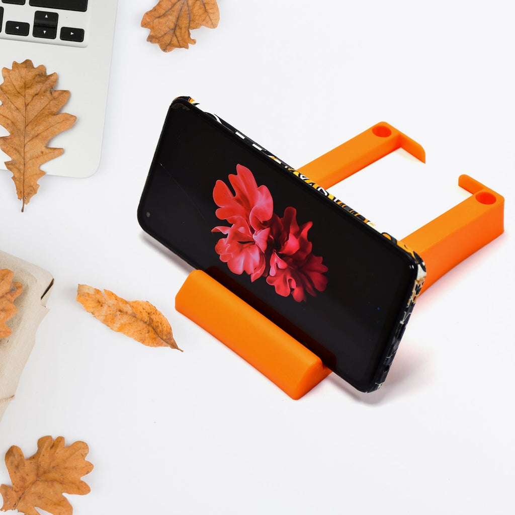 Plastic business card and mobile holder stand on desk