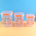 Airtight Food Storage Set with square floral containers in three sizes.