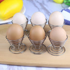 Egg cup holder with spiral spring design crafted in stainless steel