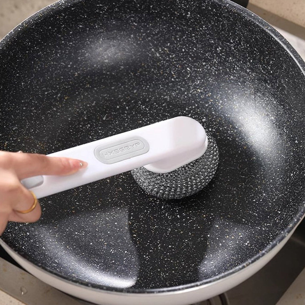 Drainable wall mounted brush holder promoting faster drying